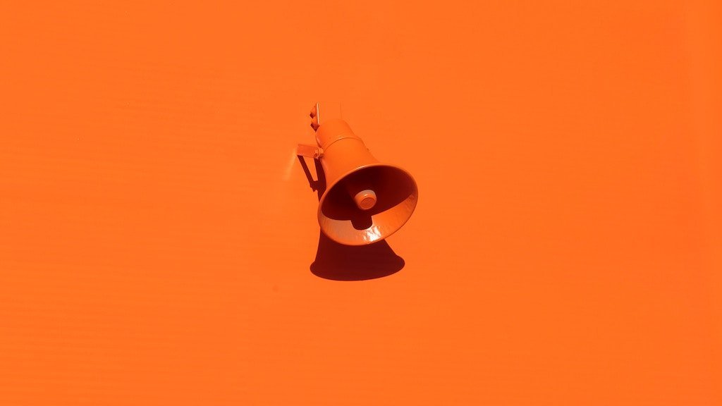 orange megaphone on orange wall