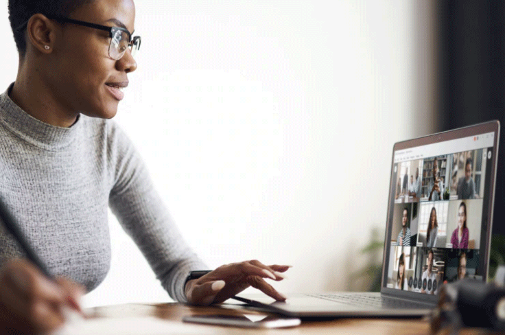 Woman on computer using Webex Meetings