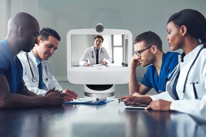 Ava Robotics and doctors sitting at a table