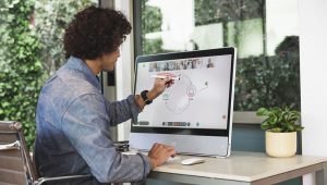 Man Using Webex Suite On Webex Desk Pro