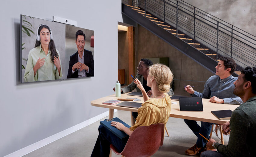 Workers In Office Using Webex Suite To Video Conference With Coworkers 