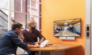 People in a meeting room having a video conference