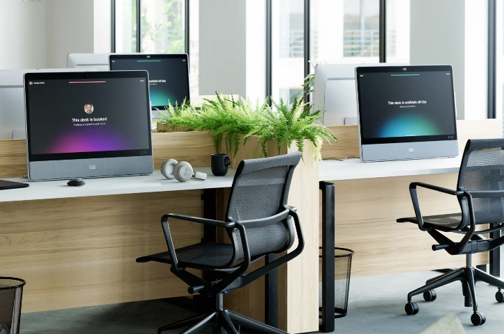 An office setup for hotdesking shows various Webex devices