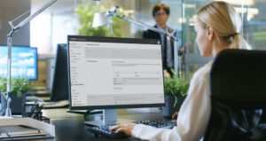 A person at an office works with Control Hub on their computer.