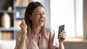 Woman Holding Apple Iphone While On Webex Meeting