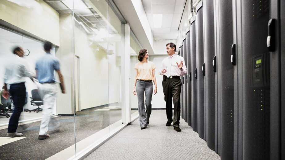 Webex Data Center With Man And Woman Walking Through