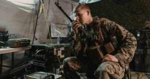 Military Solider On Phone Using Cloud Webex's Collaboration Solution For National Security And Defense