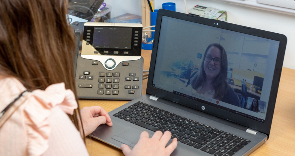 An Employee From Galway Simon Community, Galway, Ireland, Using Collaboration Device And Webex Meetings To Contact Co-Worker