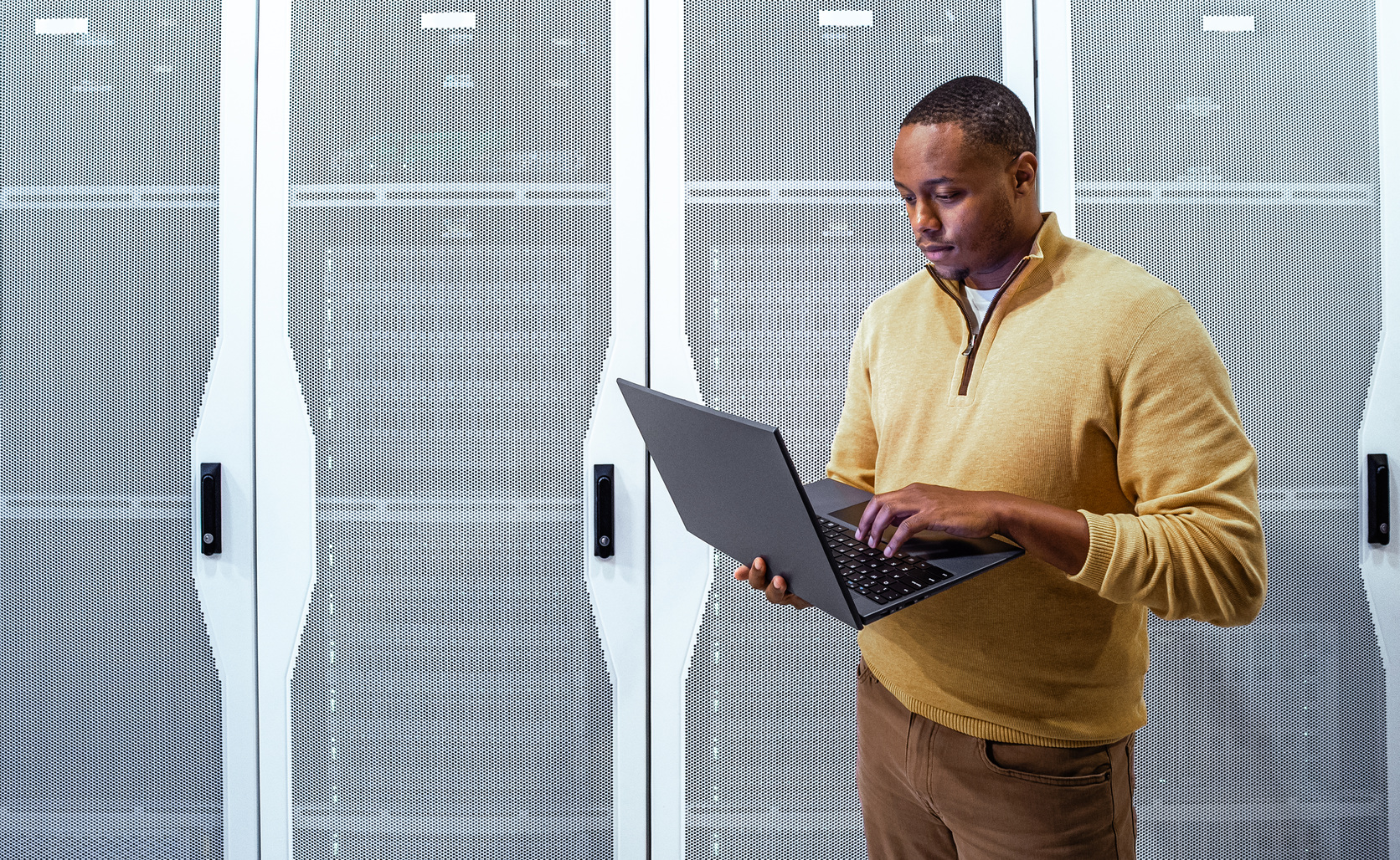 Data center professional using laptop